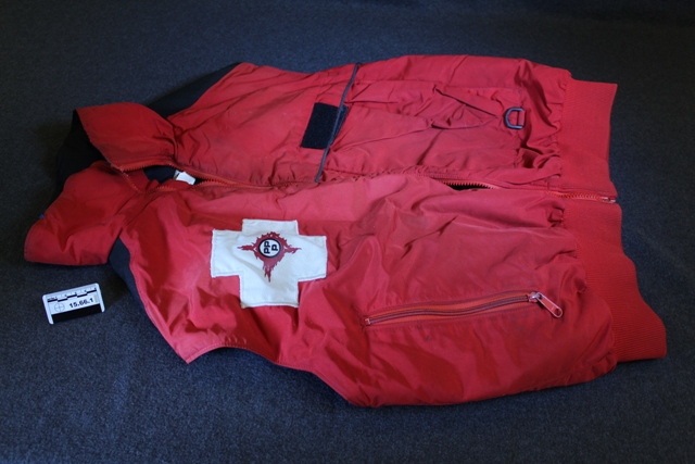 Red ski patroller's jacket